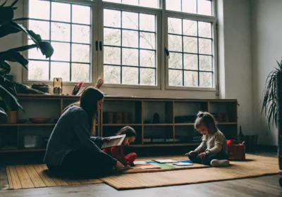 Child in an autism therapy session with a parent, learning effective social communication skills.