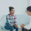 Professional therapy office with warm lighting where immigration psychological evaluations are conducted