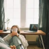 Woman at home using online therapy for PTSD to help manage flashbacks and anxiety attacks.