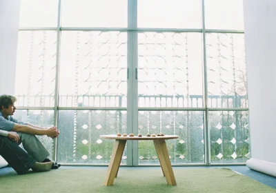 A couple sits quietly, considering the best ways to resolve recurring conflicts in their relationship.