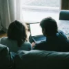 Couple preparing for a private online therapy session at home